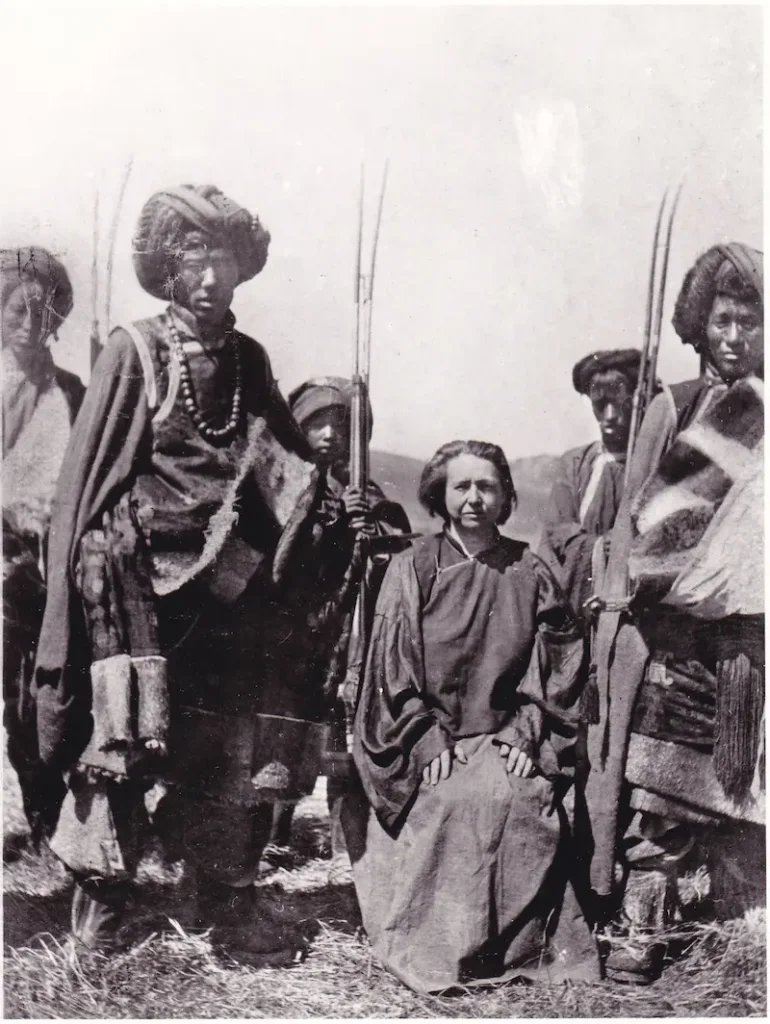 Alexandra David-Neel seated among armed Khampa horsemen in eastern Tibet, archive photograph from her house museum in Digne-les-Bains