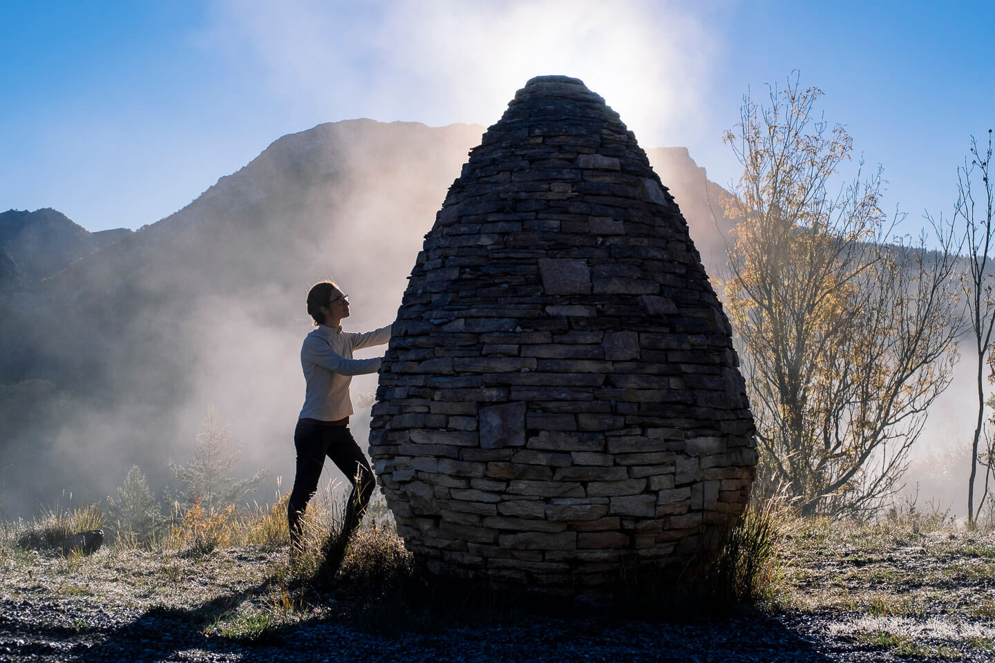 Andy Goldsworthy's Sentinelle Vallée du Vançon, a dry-stone cairn in the morning mist, Musée Gassendi mountain art collection, Haute-Provence
