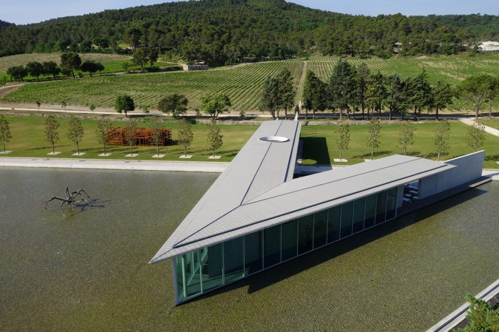 Tadao Ando's Art Centre at Château La Coste seen from above, with Louise Bourgeois's Crouching Spider in the reflecting pool and vineyards beyond